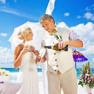 Wedding couple having champagne
